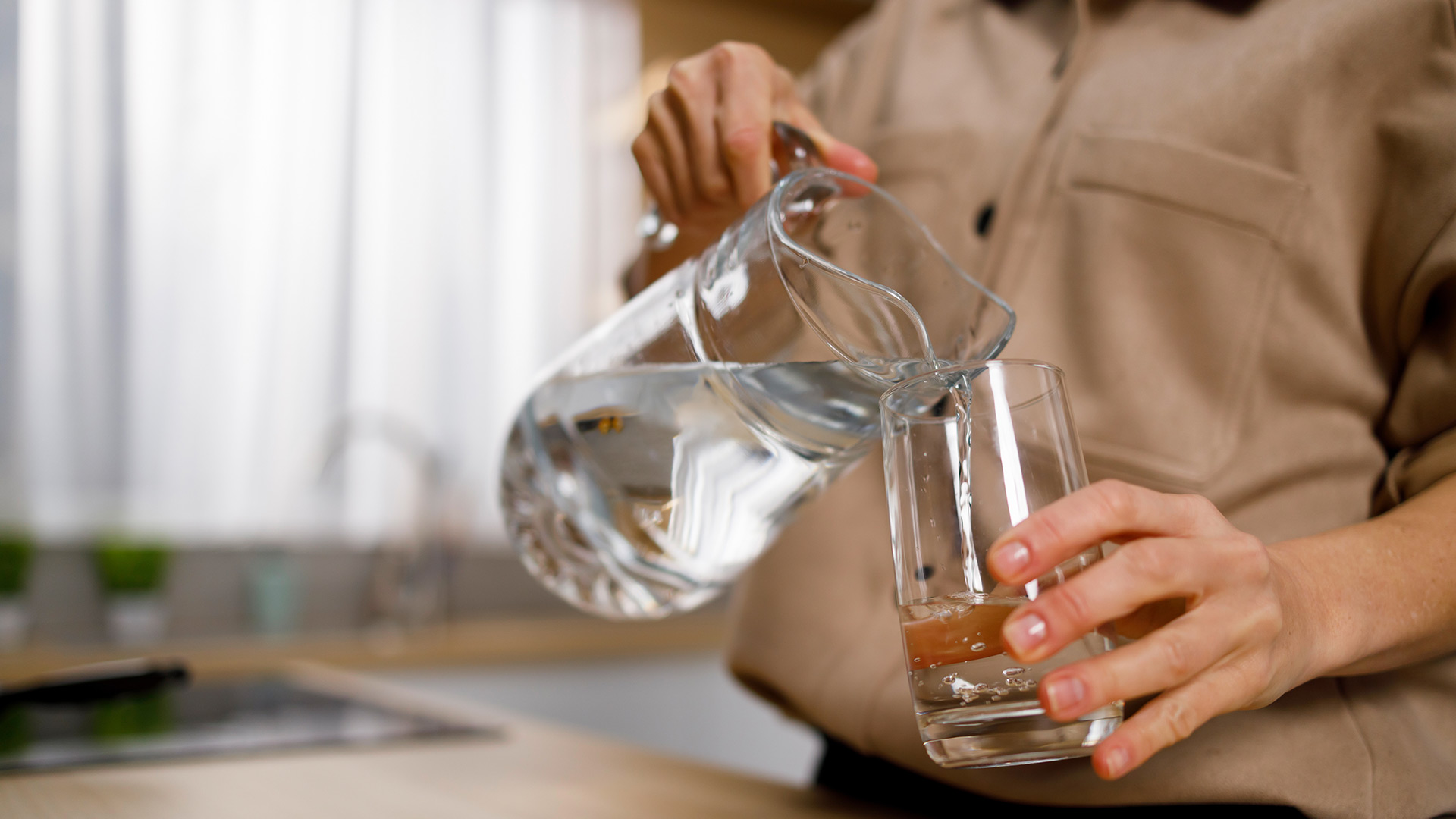 woman-pouring-water-from-jug